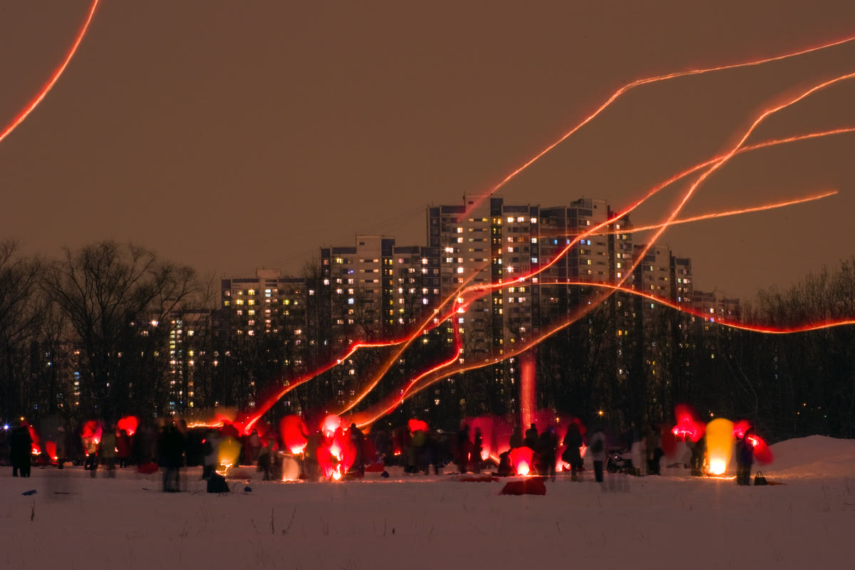 Light trails of rising sky lanterns in Moscow Light trails of rising sky lanterns in Moscow